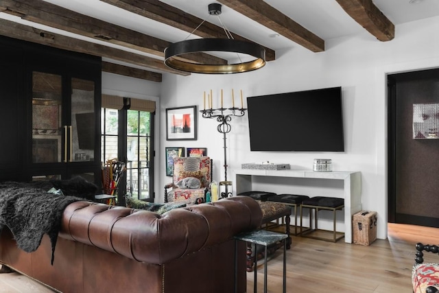 713 E 32nd St, Austin, TX 78705 - living area featuring beamed ceiling and wood finished floors