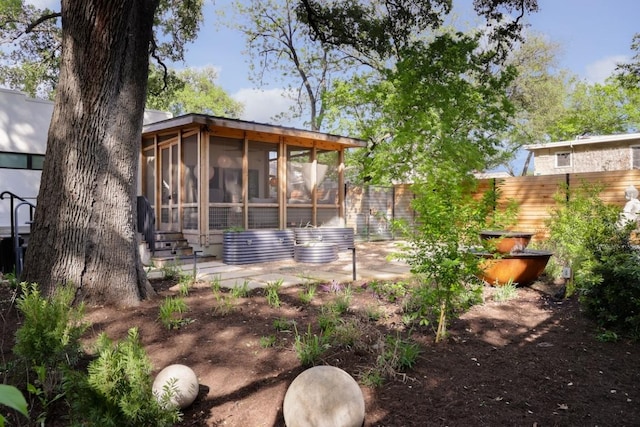 713 E 32nd St, Austin, TX 78705 - fenced backyard featuring a sunroom