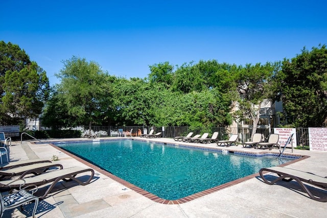 2450 Wickersham Ln Unit M1318, Austin, TX 78741 - community pool with a patio area and fence