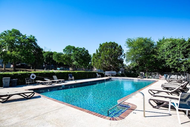 2450 Wickersham Ln Unit M1318, Austin, TX 78741 - community pool with a patio area and fence