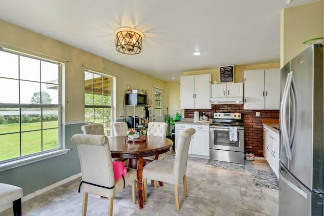 116 Hokanson Rd, Del Valle, TX 78617 - dining area with baseboards