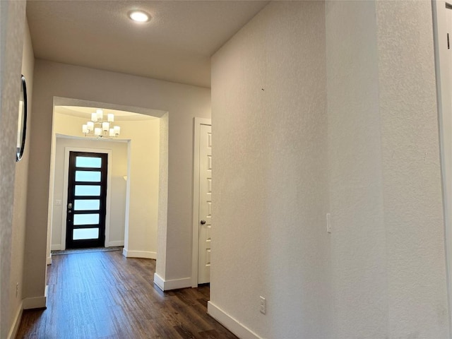 1162 Thicket Ln, New Braunfels, TX 78132 - entrance foyer with a chandelier, dark wood finished floors, and baseboards