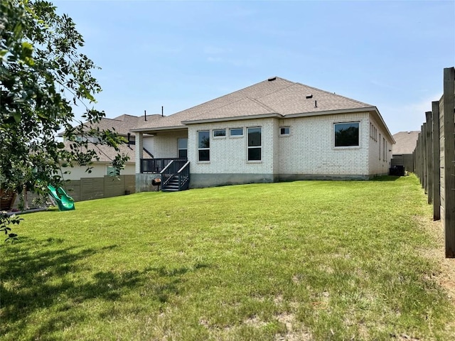 1162 Thicket Ln, New Braunfels, TX 78132 - rear view of property with brick siding, a playground, a shingled roof, and cooling unit