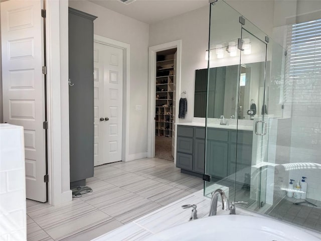 1162 Thicket Ln, New Braunfels, TX 78132 - full bath featuring a stall shower, vanity, a walk in closet, and a garden tub