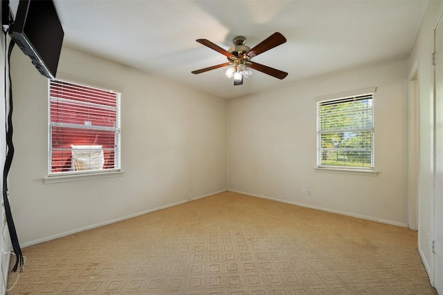 105 E St Johns Ave, Austin, TX 78752 - empty room with a ceiling fan, baseboards, and carpet