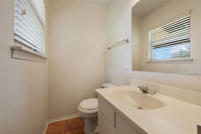 105 E St Johns Ave, Austin, TX 78752 - bathroom featuring toilet, vanity, tile patterned floors, and baseboards