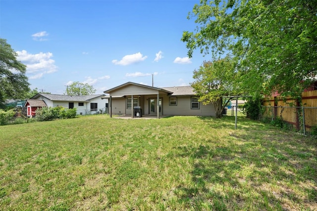 105 E St Johns Ave, Austin, TX 78752 - rear view of house featuring a patio
