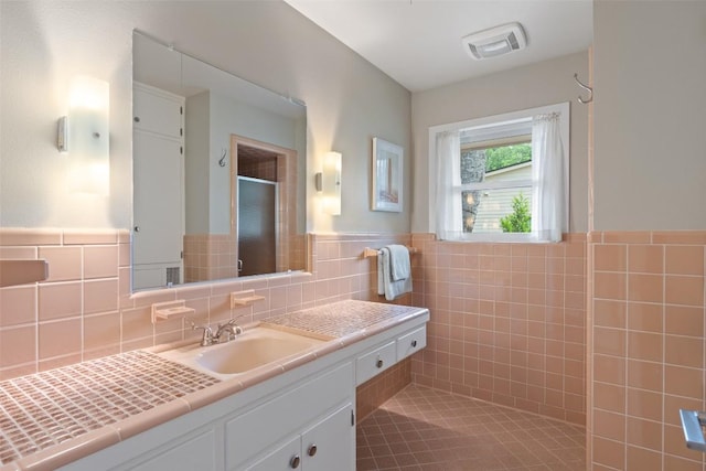 1254 S Church St, Georgetown, TX 78626 - full bath featuring vanity, a shower with door, and wainscoting