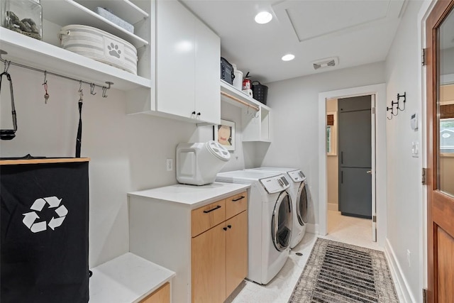 1254 S Church St, Georgetown, TX 78626 - laundry area with cabinet space, washer and clothes dryer, attic access, recessed lighting, and light tile patterned floors