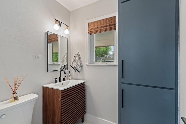 1254 S Church St, Georgetown, TX 78626 - bathroom with toilet, vanity, and baseboards