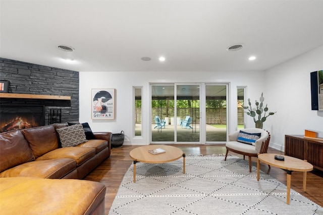 1254 S Church St, Georgetown, TX 78626 - living room featuring wood finished floors, a fireplace, baseboards, and recessed lighting