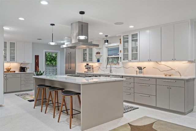 1254 S Church St, Georgetown, TX 78626 - kitchen featuring island range hood, a kitchen bar, a center island, gray cabinets, and recessed lighting