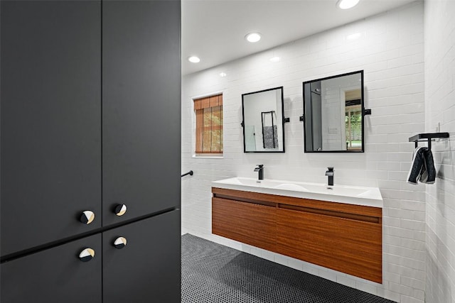 1254 S Church St, Georgetown, TX 78626 - bathroom with double vanity, recessed lighting, tile walls, and tile patterned flooring