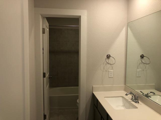 22617 Agave Grove Dr, Lago Vista, TX 78645 - full bath with vanity, tile patterned flooring, and shower / bathtub combination