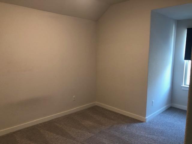 22617 Agave Grove Dr, Lago Vista, TX 78645 - empty room with carpet and lofted ceiling