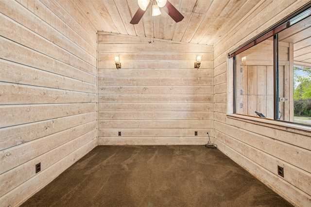 119 Topspin Cir, Spicewood, TX 78669 - empty room with wooden walls, wood ceiling, ceiling fan, and dark colored carpet