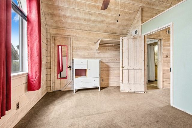 119 Topspin Cir, Spicewood, TX 78669 - unfurnished bedroom featuring wooden ceiling, lofted ceiling, multiple windows, carpet, and wooden walls