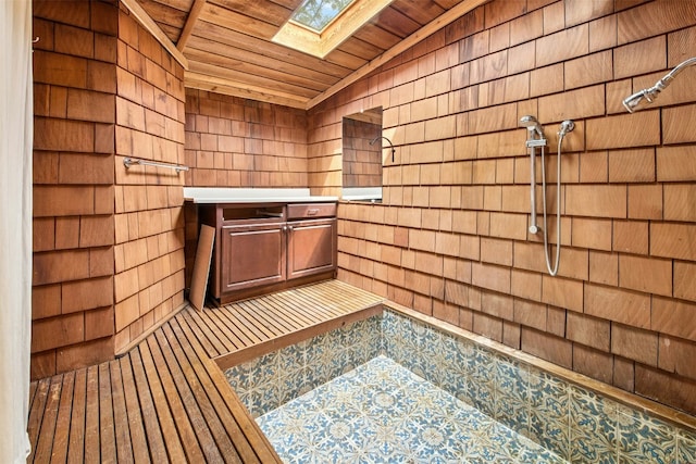 119 Topspin Cir, Spicewood, TX 78669 - relaxing sauna / steam room with wood ceiling, a skylight, wood walls, and tile patterned floors