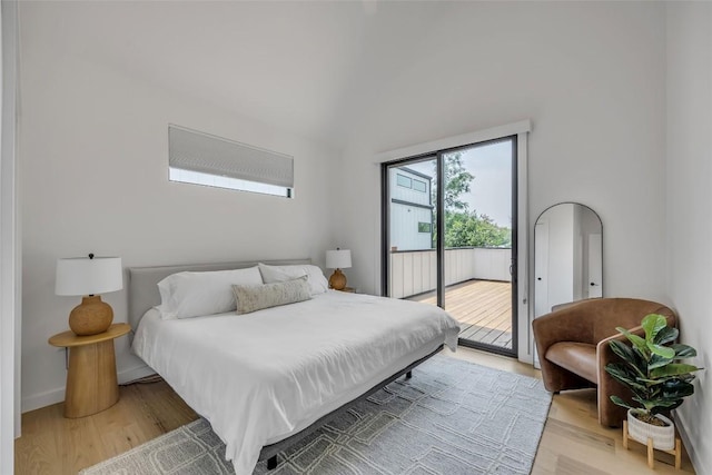3409 Neal St Unit 2, Austin, TX 78702 - bedroom with access to outside, light wood finished floors, vaulted ceiling, and baseboards