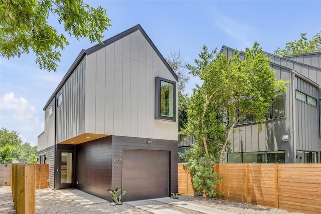 3409 Neal St Unit 2, Austin, TX 78702 - contemporary house featuring board and batten siding and a garage