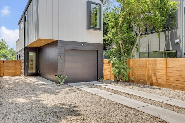 3409 Neal St Unit 2, Austin, TX 78702 - view of side of property featuring an attached garage and fence