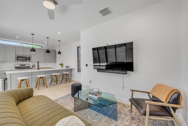 3409 Neal St Unit 2, Austin, TX 78702 - living room with baseboards, ceiling fan, and recessed lighting