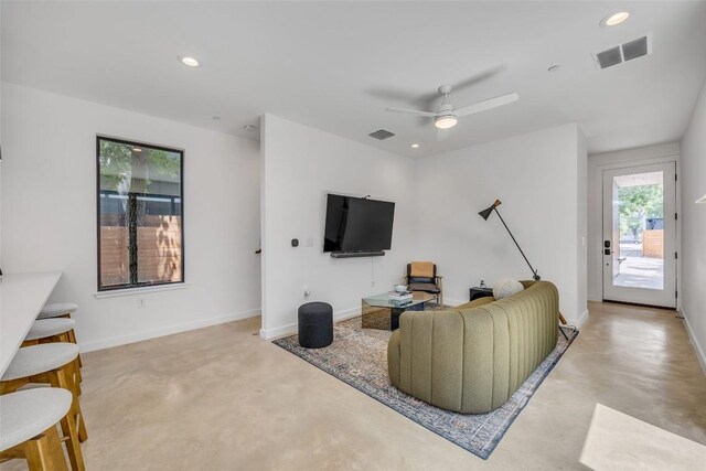 3409 Neal St Unit 2, Austin, TX 78702 - living room with concrete floors, recessed lighting, ceiling fan, and baseboards