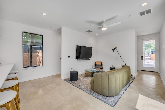 3409 Neal St Unit 2, Austin, TX 78702 - living room with finished concrete flooring, recessed lighting, a ceiling fan, and baseboards