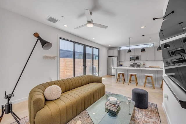 3409 Neal St Unit 2, Austin, TX 78702 - living area with ceiling fan, baseboards, and recessed lighting