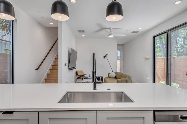 3409 Neal St Unit 2, Austin, TX 78702 - kitchen with a sink, dishwasher, light countertops, open floor plan, and recessed lighting