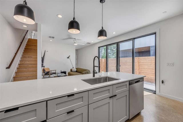 3409 Neal St Unit 2, Austin, TX 78702 - kitchen featuring stainless steel dishwasher, a sink, gray cabinets, light countertops, and recessed lighting