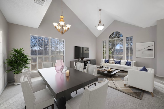 16901 Dashwood Creek Dr, Pflugerville, TX 78660 - dining space with light colored carpet, a chandelier, and high vaulted ceiling