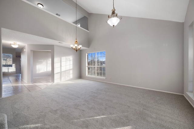 16901 Dashwood Creek Dr, Pflugerville, TX 78660 - unfurnished room with carpet floors, a chandelier, baseboards, and high vaulted ceiling