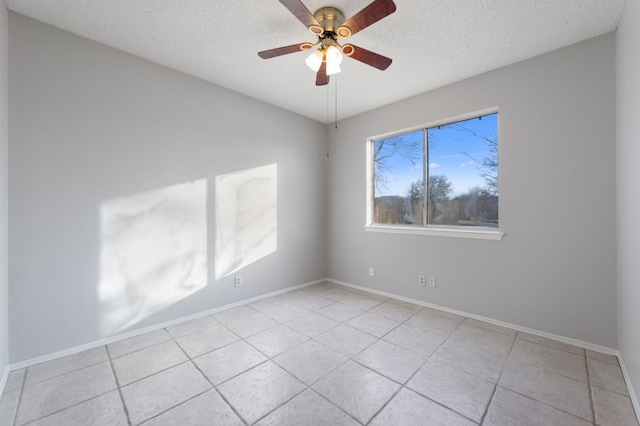 16901 Dashwood Creek Dr, Pflugerville, TX 78660 - empty room with light tile patterned floors, ceiling fan, and a textured ceiling