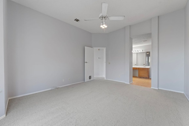 16901 Dashwood Creek Dr, Pflugerville, TX 78660 - unfurnished bedroom featuring light carpet, baseboards, ensuite bath, and ceiling fan