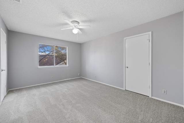 16901 Dashwood Creek Dr, Pflugerville, TX 78660 - unfurnished bedroom featuring carpet floors, a textured ceiling, and baseboards