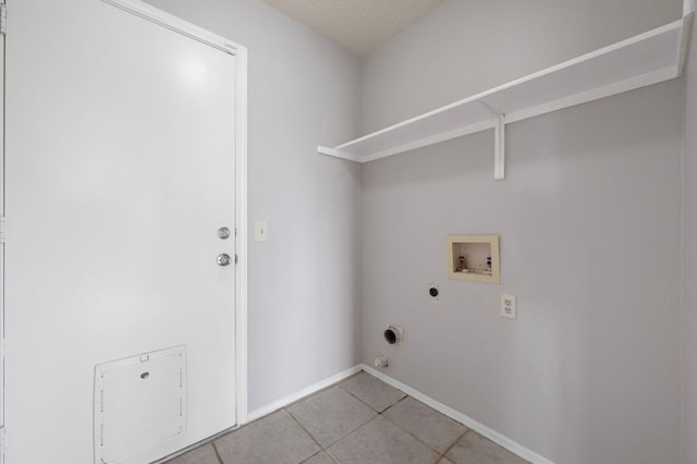 16901 Dashwood Creek Dr, Pflugerville, TX 78660 - laundry room featuring hookup for a washing machine, electric dryer hookup, light tile patterned floors, and baseboards