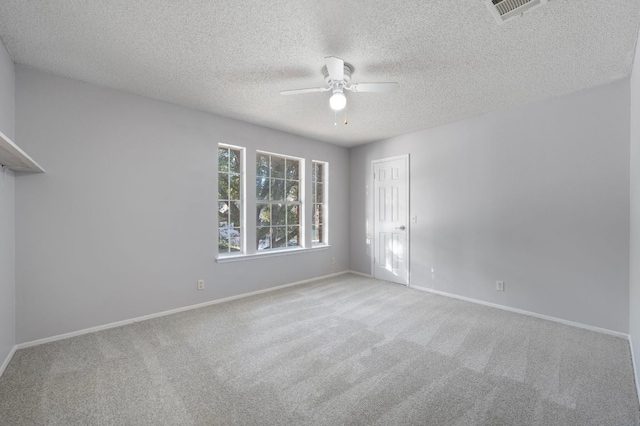 16901 Dashwood Creek Dr, Pflugerville, TX 78660 - spare room featuring a ceiling fan, carpet flooring, and a textured ceiling