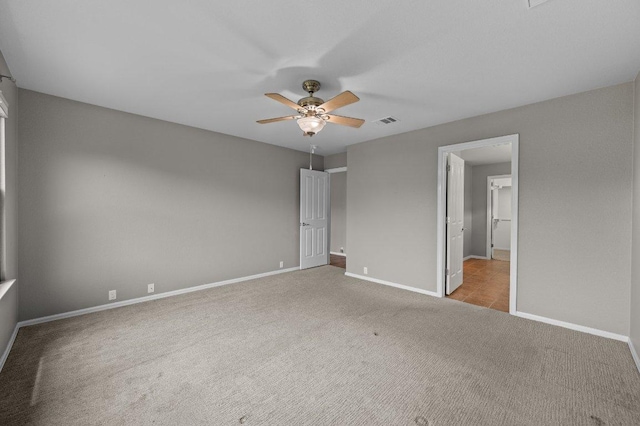 141 Snowy Egret Ln, Leander, TX 78641 - unfurnished bedroom with carpet, baseboards, and a ceiling fan