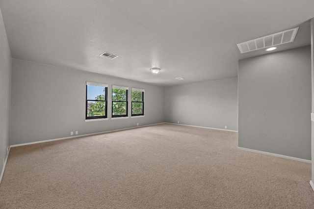 spare room with carpet floors and baseboards