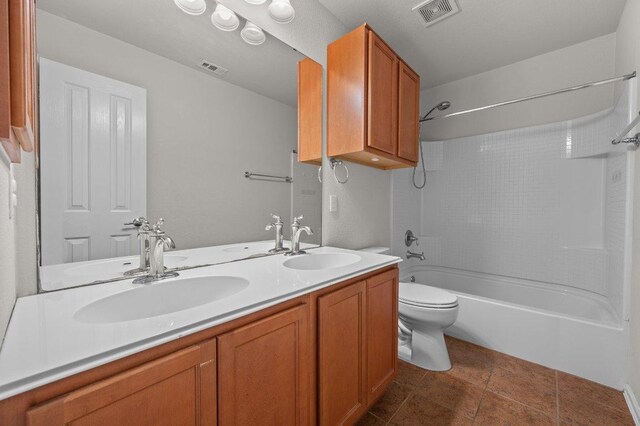 141 Snowy Egret Ln, Leander, TX 78641 - bathroom with washtub / shower combination, double vanity, and toilet