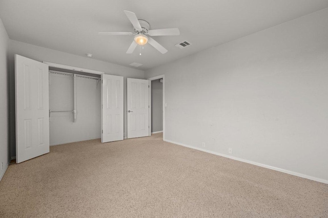141 Snowy Egret Ln, Leander, TX 78641 - unfurnished bedroom with light carpet, a closet, and ceiling fan