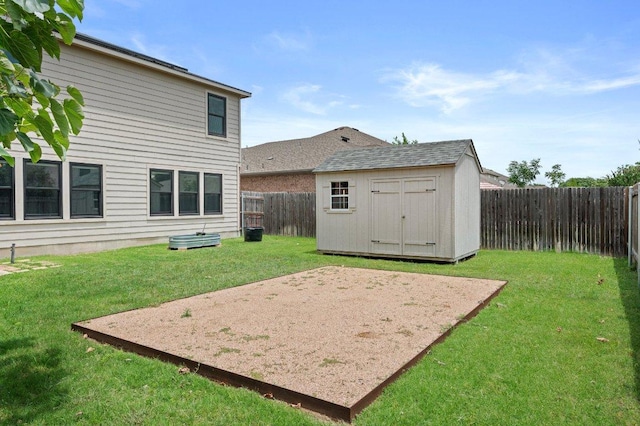 view of yard featuring a storage shed, an outdoor structure, and a patio