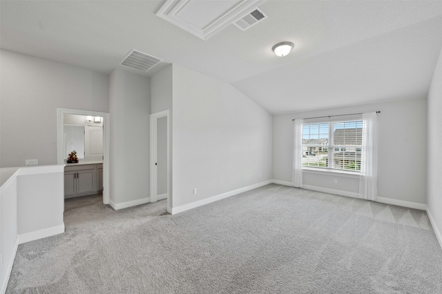 142 Dome Peak Ter, Dripping Springs, TX 78620 - unfurnished room featuring light carpet, lofted ceiling, and attic access