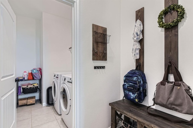 206 Monteforte Rd, Hutto, TX 78634 - clothes washing area featuring washer and clothes dryer and light tile patterned floors