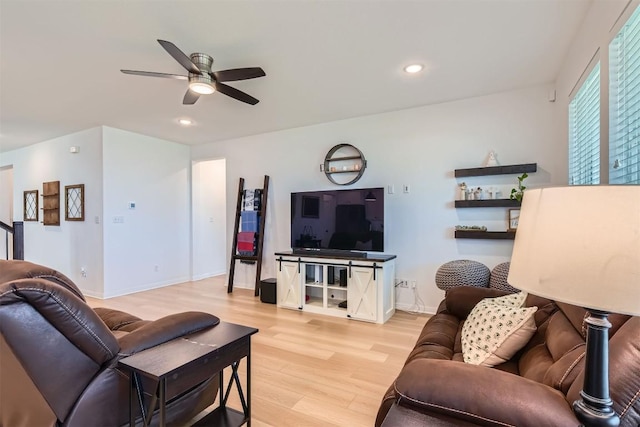 206 Monteforte Rd, Hutto, TX 78634 - living area with light wood finished floors, ceiling fan, recessed lighting, and baseboards