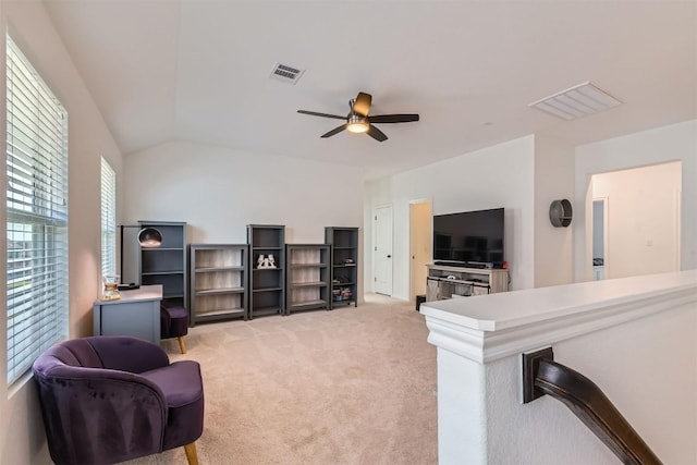 206 Monteforte Rd, Hutto, TX 78634 - living room with ceiling fan, light carpet, and vaulted ceiling
