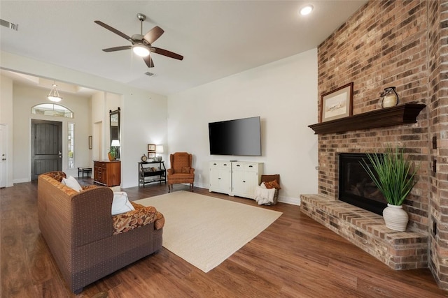 152 Baretta Loop, Buda, TX 78610 - living room featuring ceiling fan, wood finished floors, a fireplace, and baseboards