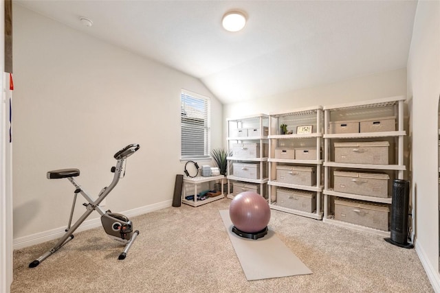 152 Baretta Loop, Buda, TX 78610 - workout area featuring carpet, vaulted ceiling, and baseboards