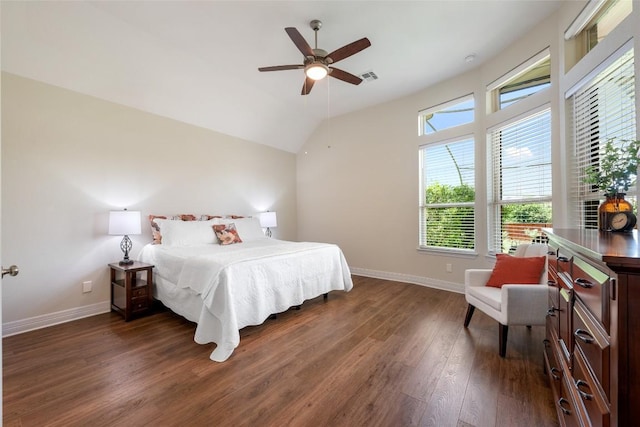 152 Baretta Loop, Buda, TX 78610 - bedroom with dark wood-type flooring, baseboards, vaulted ceiling, and a ceiling fan